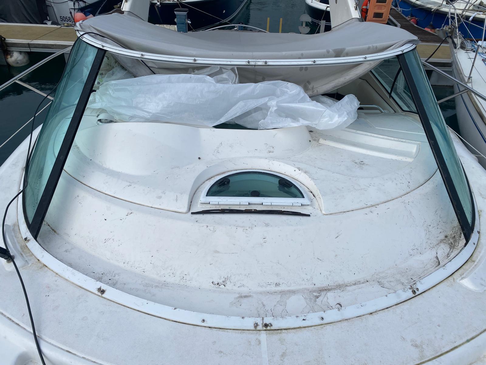 Yacht with damaged and missing windshield